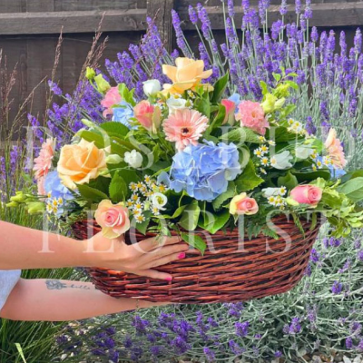 Summer Garden Basket - A delightful basket of vibrant summer flowers, ideal for bringing the warmth and beauty of a garden indoors.